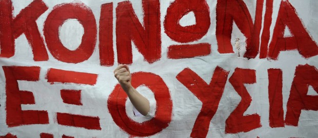 "A banner reads 'yes to the society no to the power' during a rally against plans for new austerity measures, in Thessaloniki, Greece, June 15, 2011" (Nikolas Giakoumidis/Associated Press)