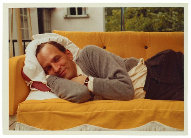 Color portrait of Ingmar Bergman lying on a couch, unknown photographer (possibly his wife Käbi Laretei), 1960s