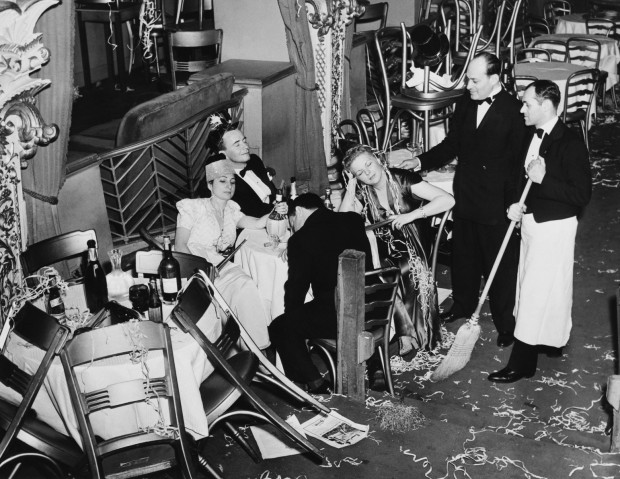Original caption: “New York, NY: Employees of Bily Roses Diamond Horseshoe are shown trying to rouse a party of drowsy merry makers in order to proceed with their cleaning after a gay throng welcomed in the New Year” Corbis stock photo ID BE076357. © Bettmann/CORBIS.